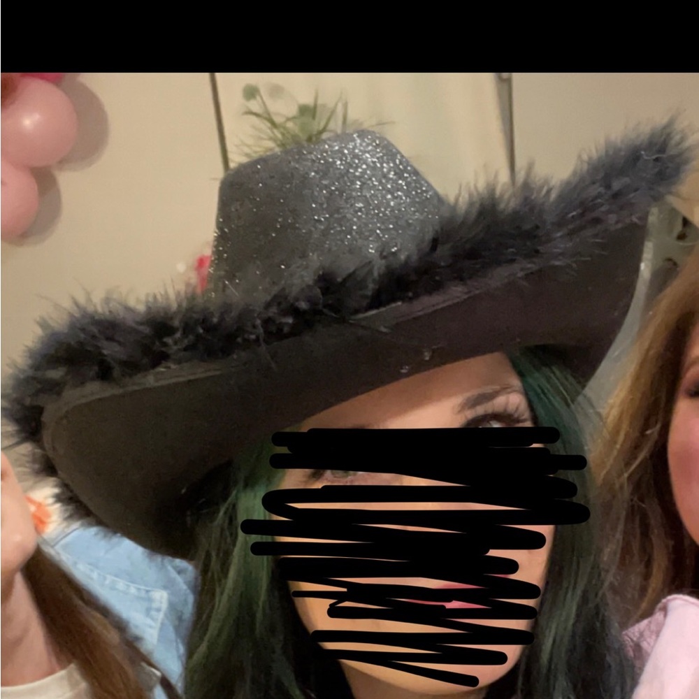 Black glitter and feather cowgirl hat